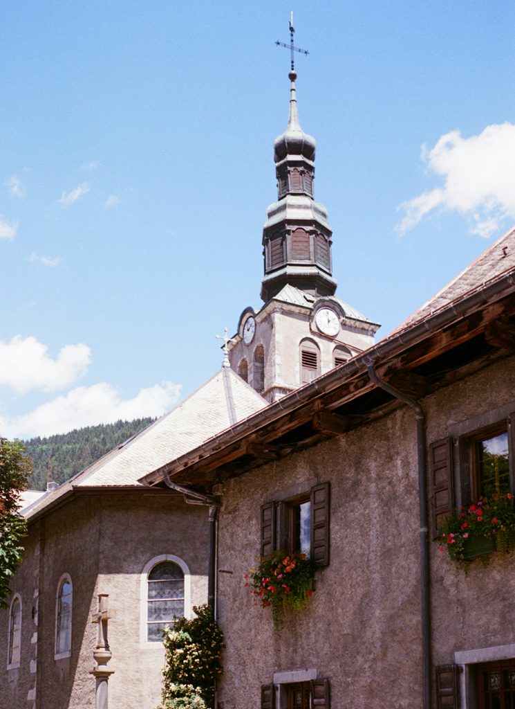 Morzine village church beneath the mountains