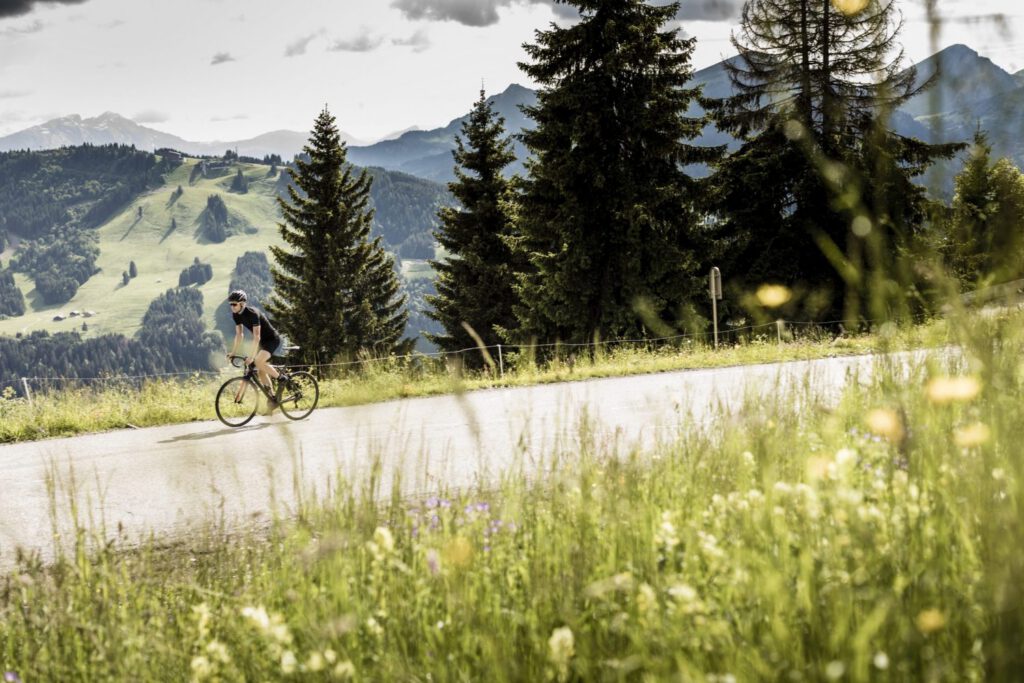 Road cyclist riding through the mountains near Avoriaz