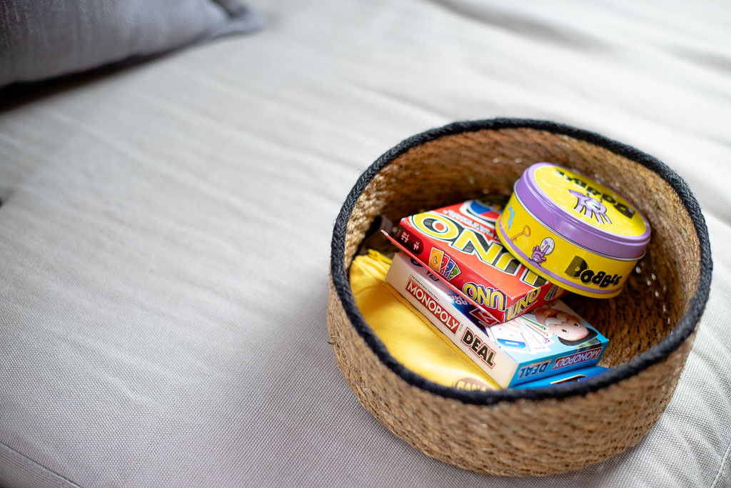 Basket of board games available for guests staying at Chalet Coffy in Morzine