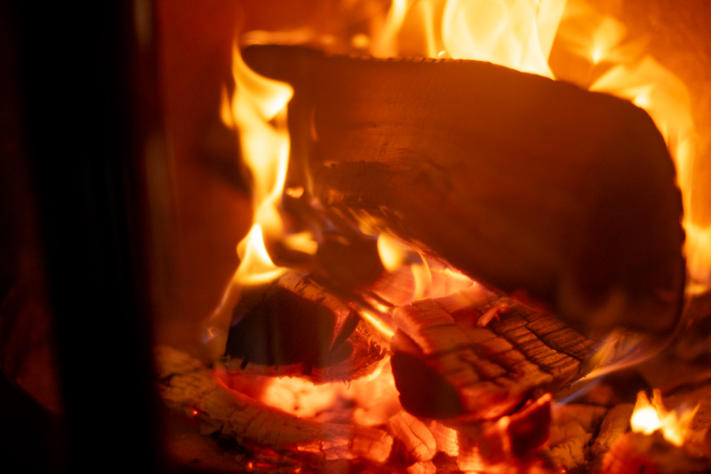 Close-up of a warm log fire burning at Chalet Coffy in Morzine