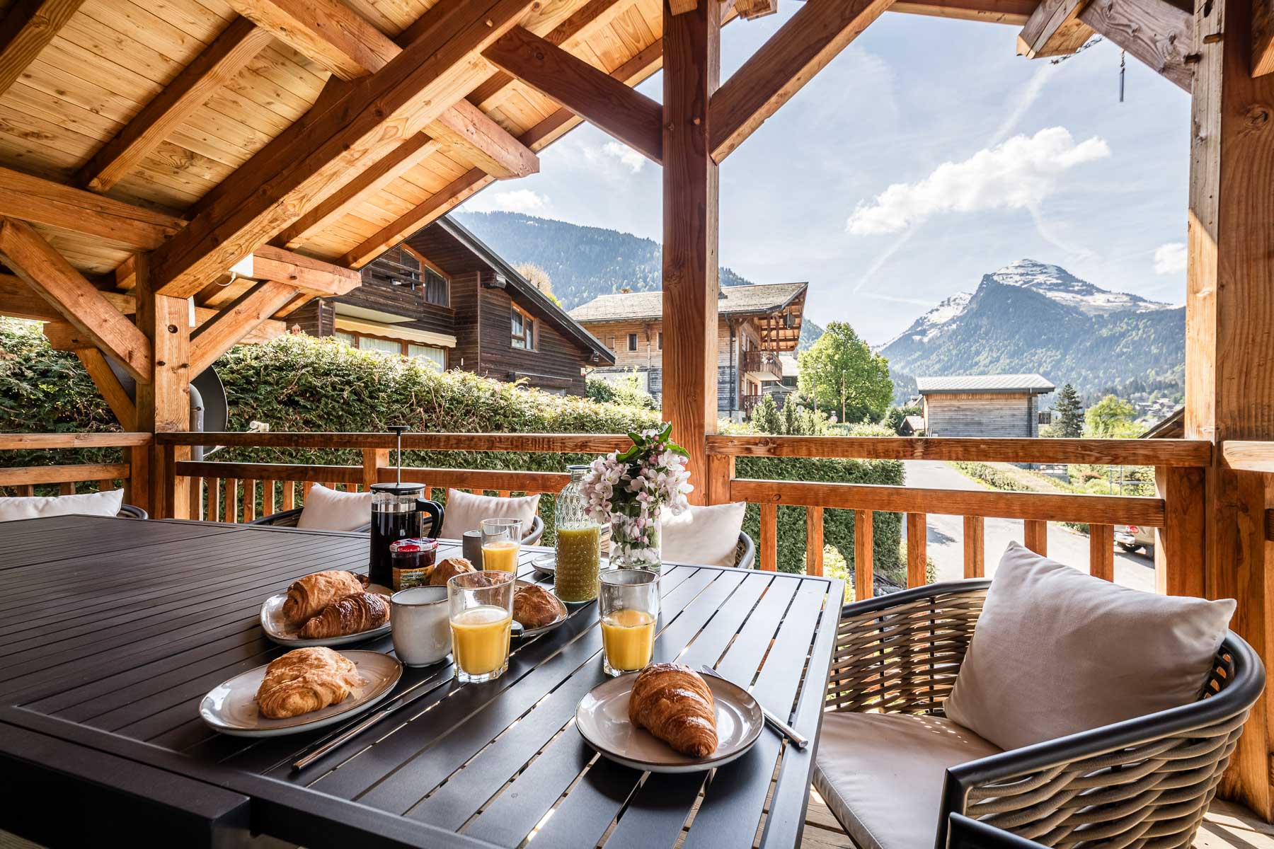 Breakfast on the Chalet Floralies balcony overlooking the mountains