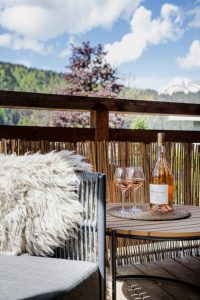 Rosé wine on the Chalet Floralies balcony overlooking Morzine