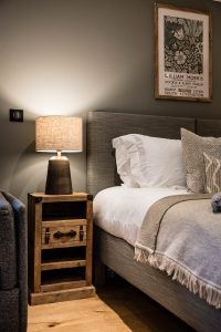 Bedside area in a bedroom at Chalet Floralies