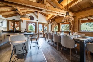Dining area and kitchen with mountain views at Chalet Floralies