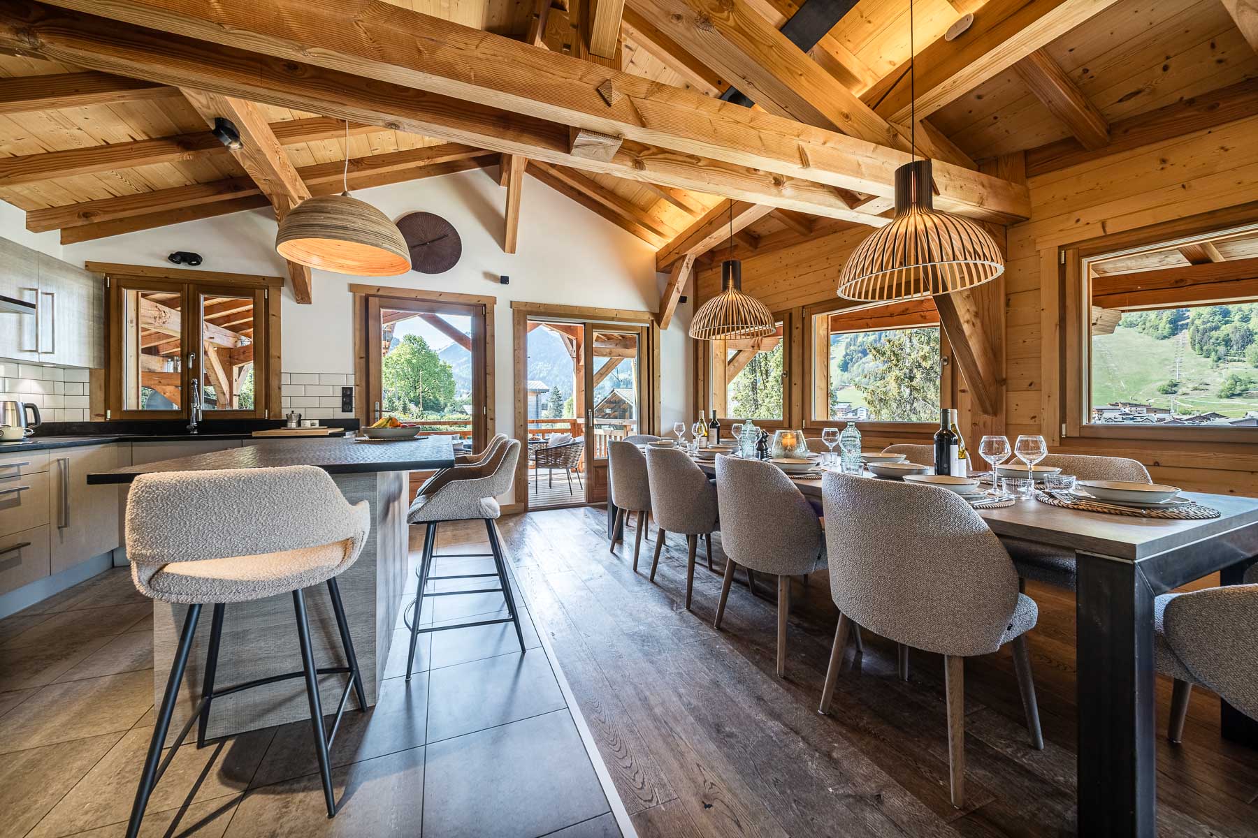 Dining area and kitchen with mountain views at Chalet Floralies