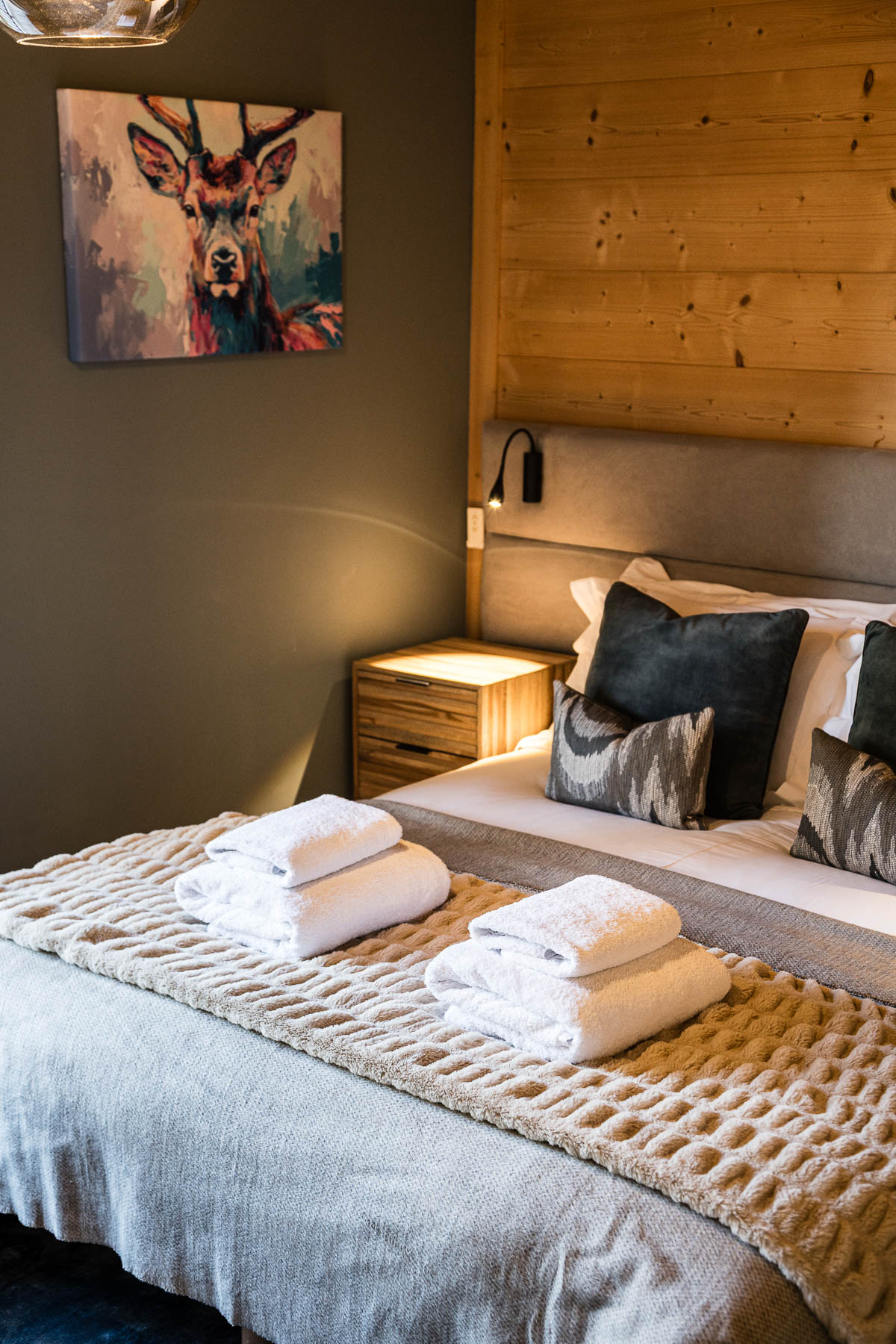 Double bedroom with deer artwork at Chalet Floralies