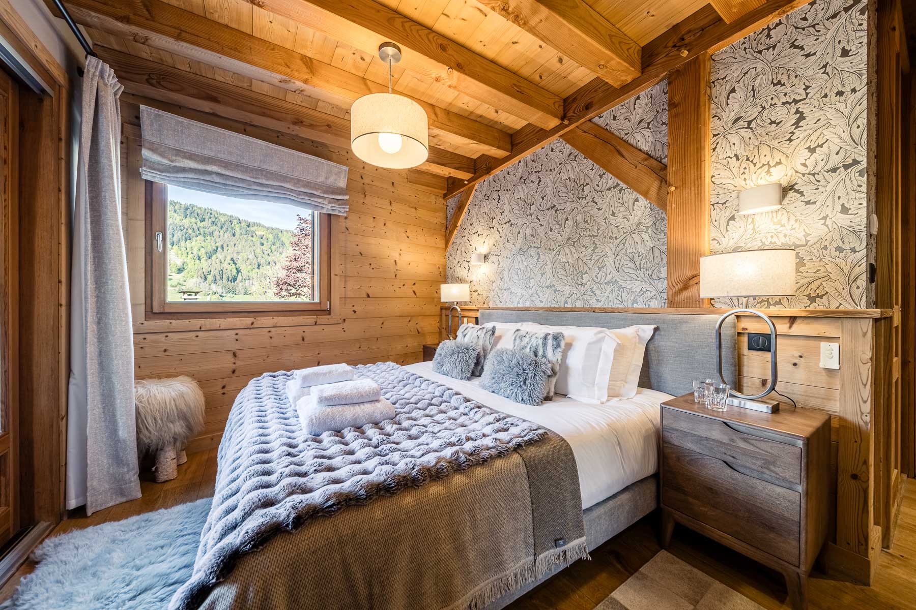 Double bedroom with mountain views at Chalet Floralies