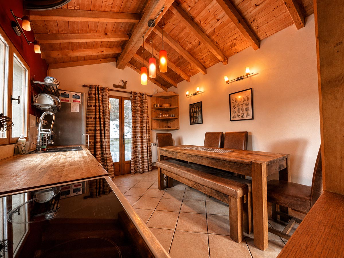 Rustic kitchen and dining area at Chalet Greniette