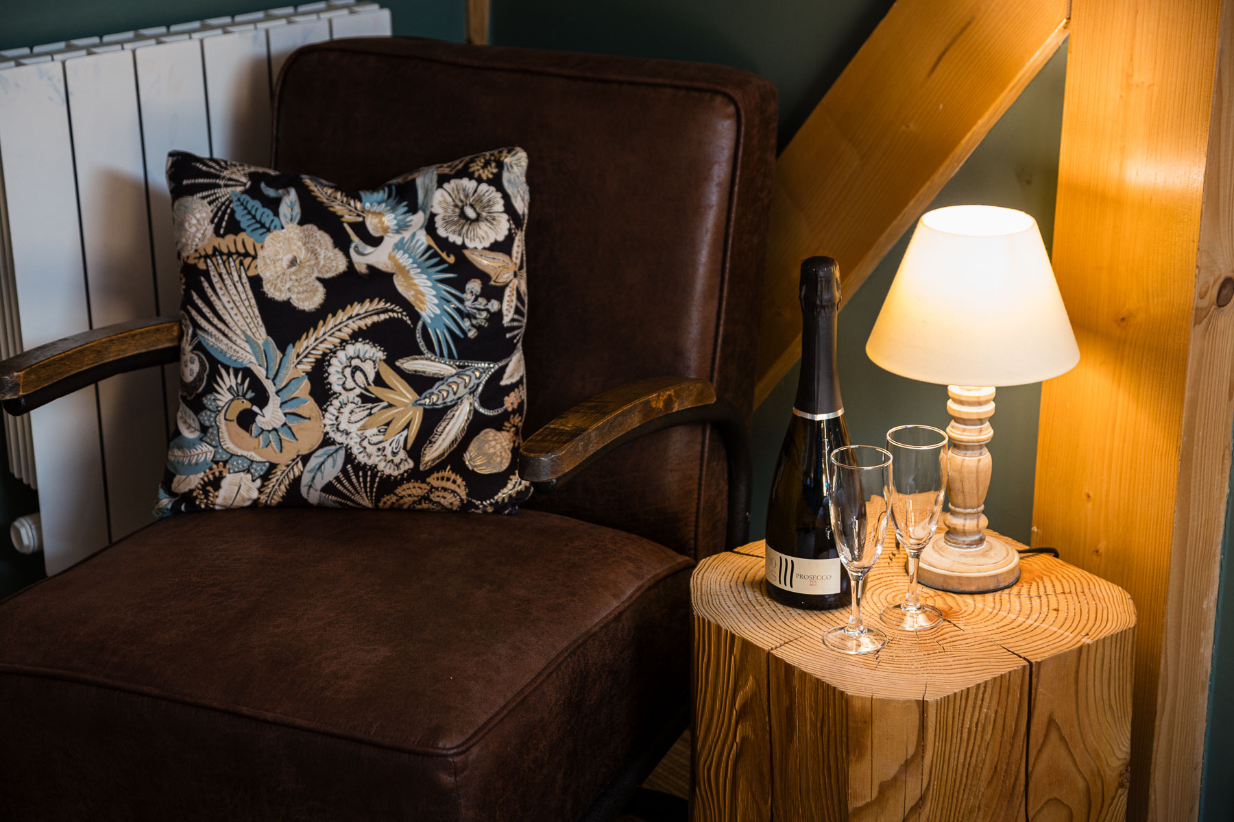 Bedroom armchair and prosecco at Chalet La Grange