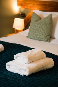 Towels prepared in a bedroom at Chalet La Grange