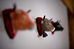 Carved cow bell wall decoration at Chalet La Grange