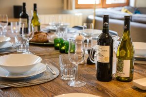 Dining table set with wine at Chalet La Grange