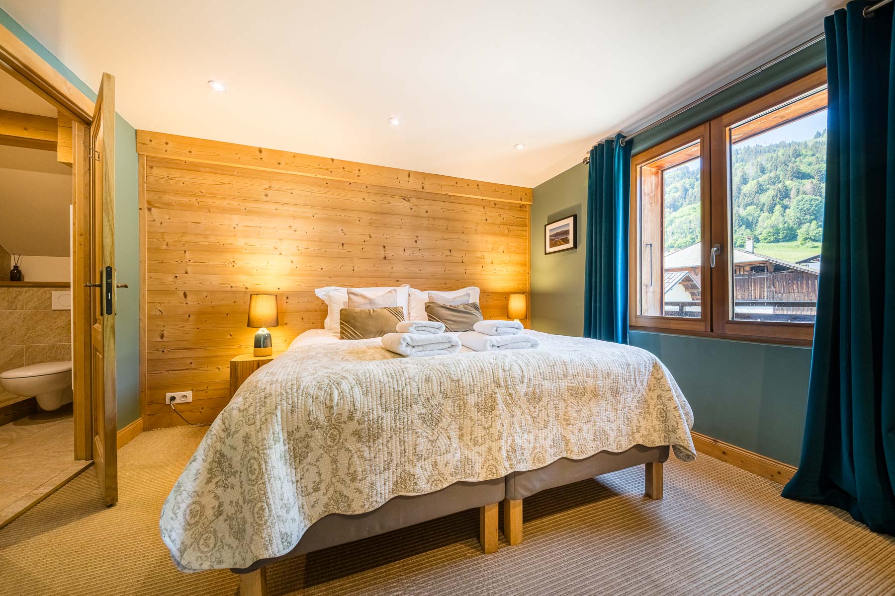 Double bedroom with forest views at Chalet La Grange