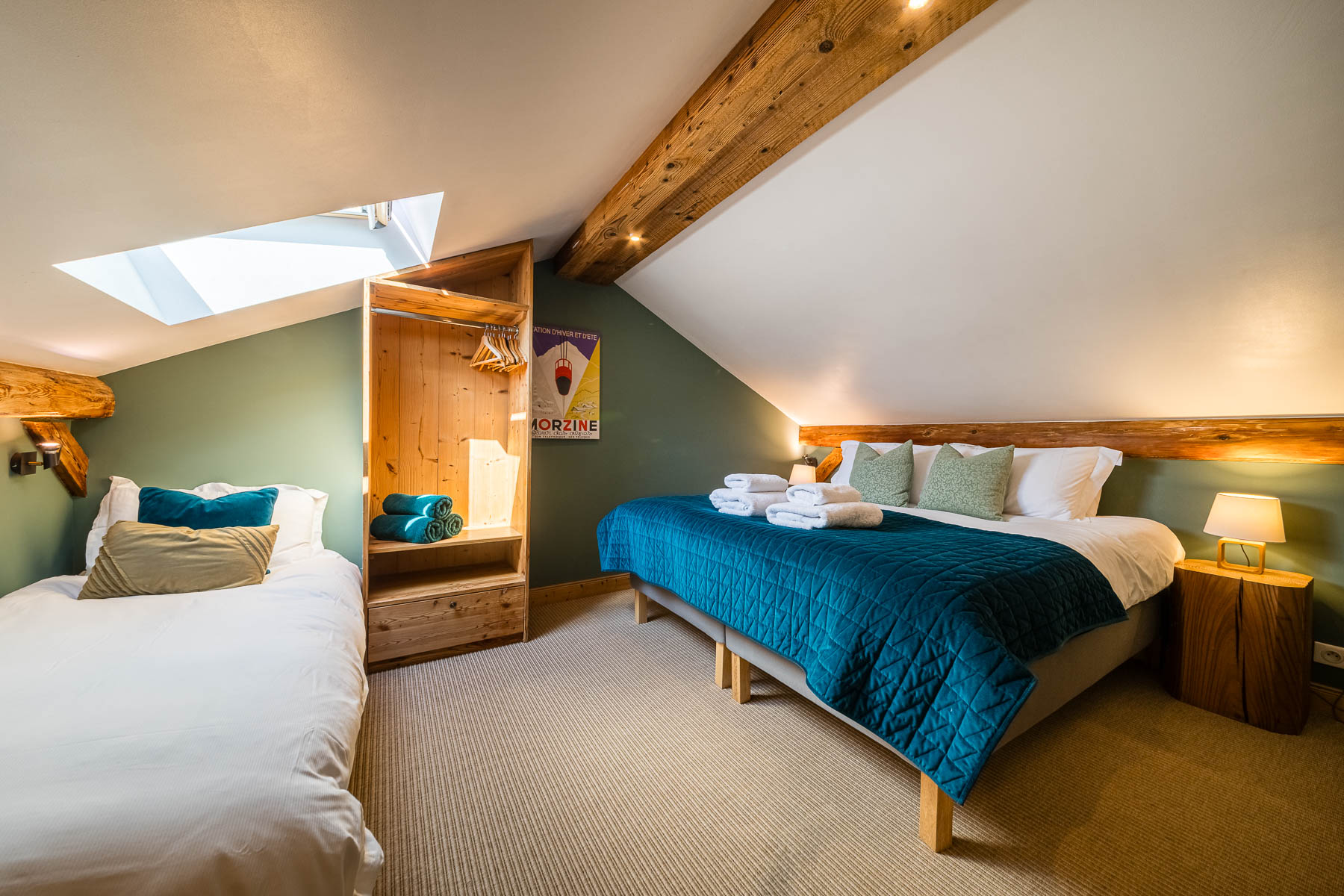 Loft family bedroom with skylight at Chalet La Grange