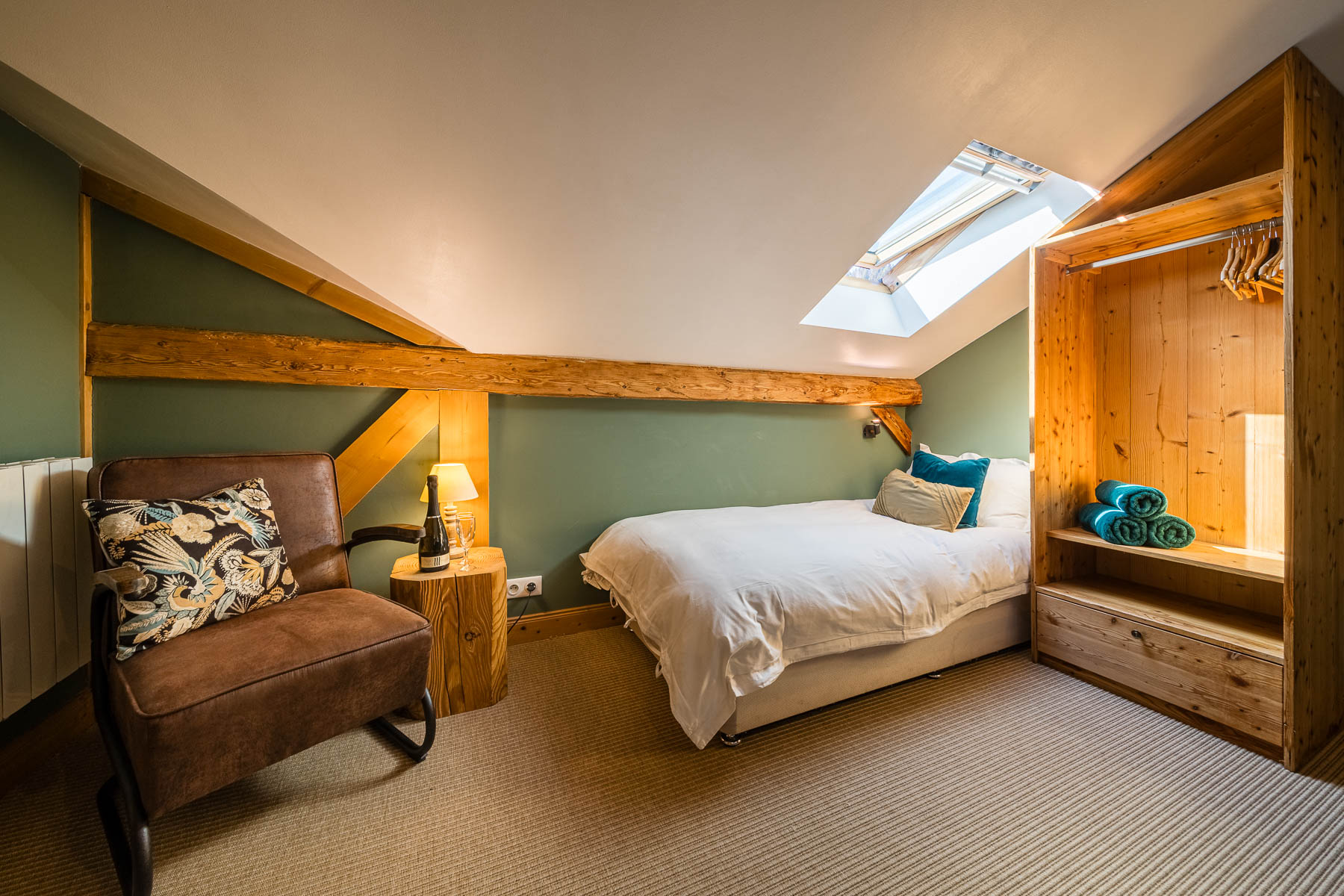 Loft bedroom beneath the eaves at Chalet La Grange
