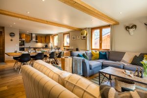 Open-plan lounge, dining area and kitchen at Chalet La Grange