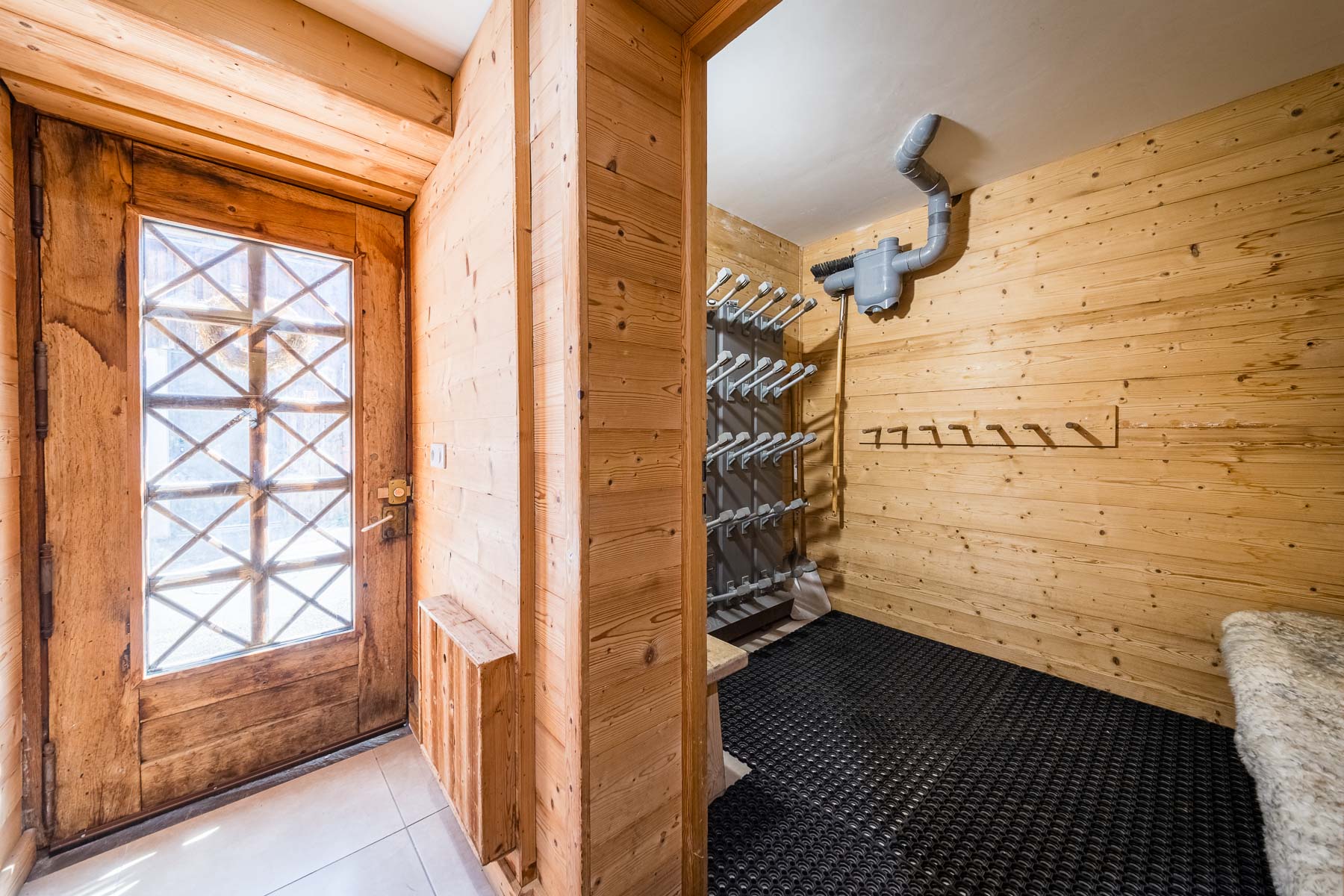 Ski boot room with drying rack at Chalet La Grange