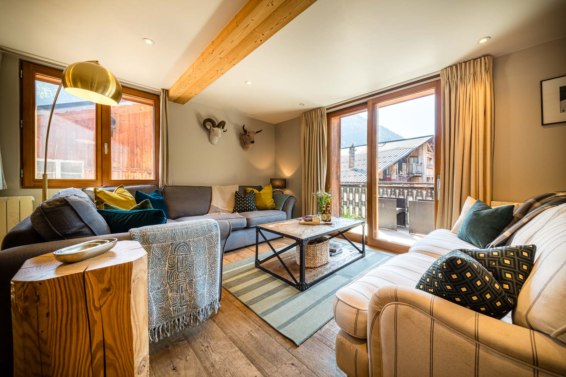 Spacious lounge opening onto the balcony at Chalet La Grange