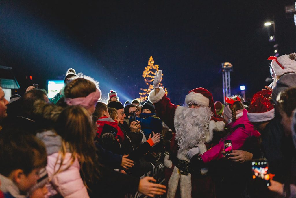 Father Christmas greeting families in Morzine