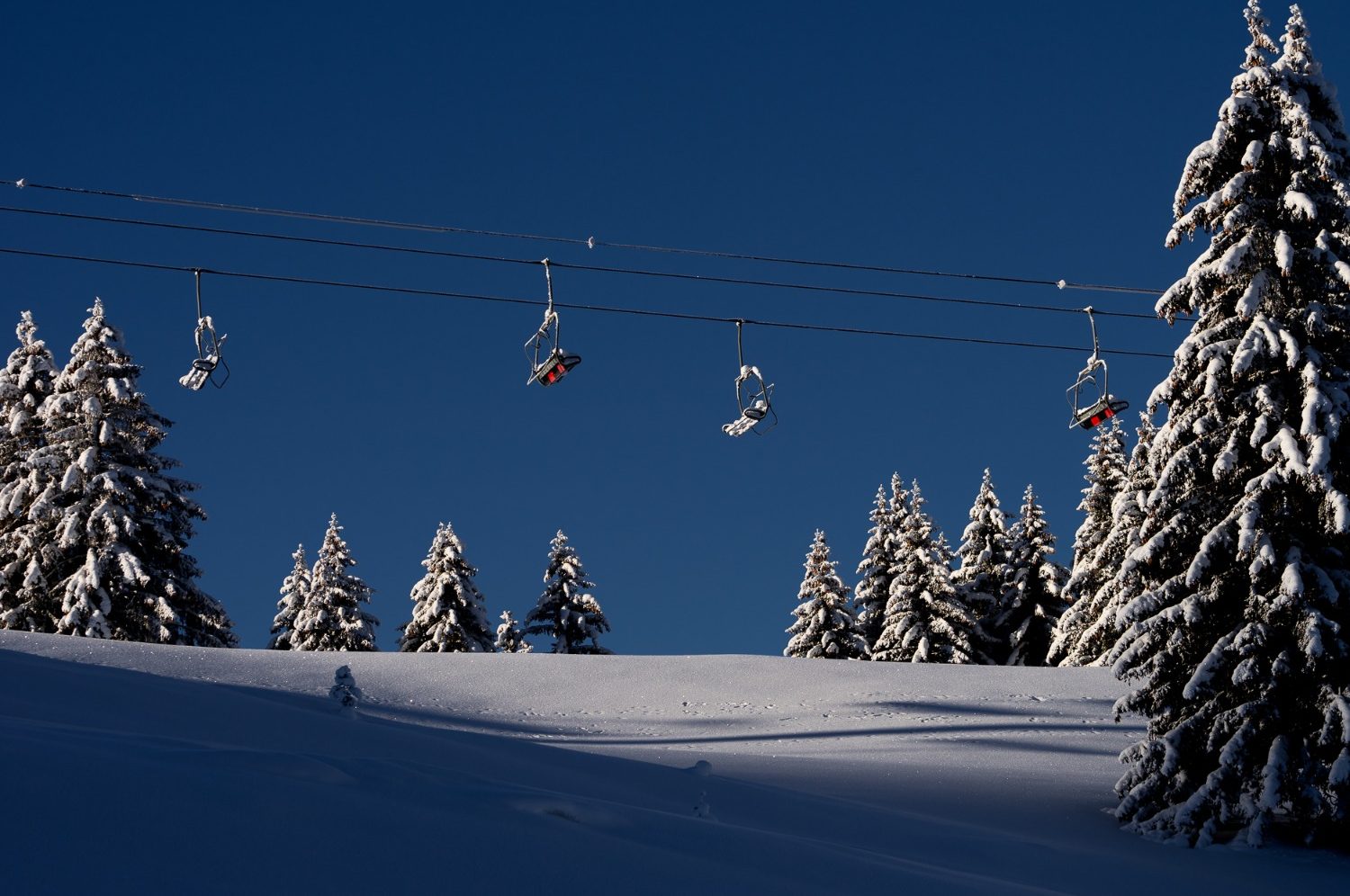 Ski lift above the snowy slopes in Morzine